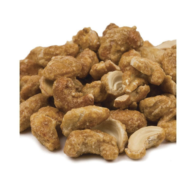 cashew nuts, toasted and golden, are coated with a thin sweet coating